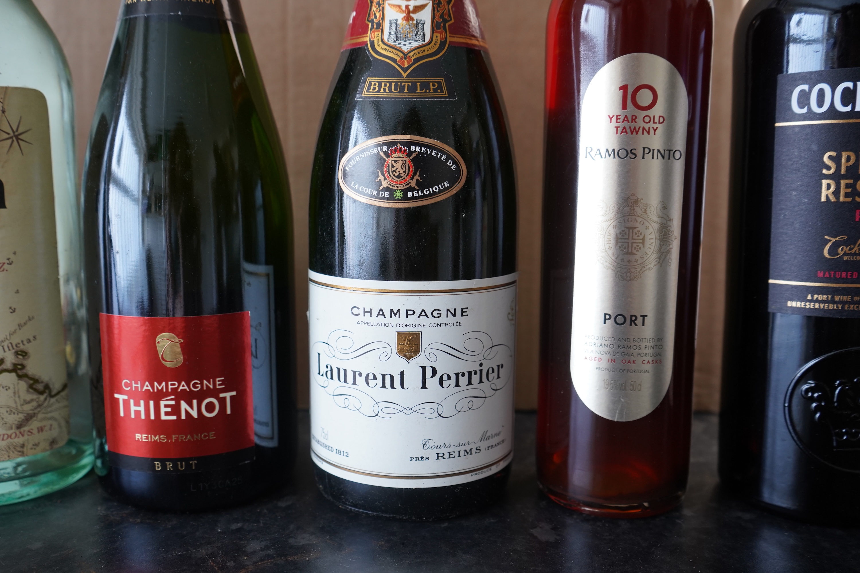 Eight bottles of champagne, port and rum to include Mumm, Laurent Perrier and Warres
